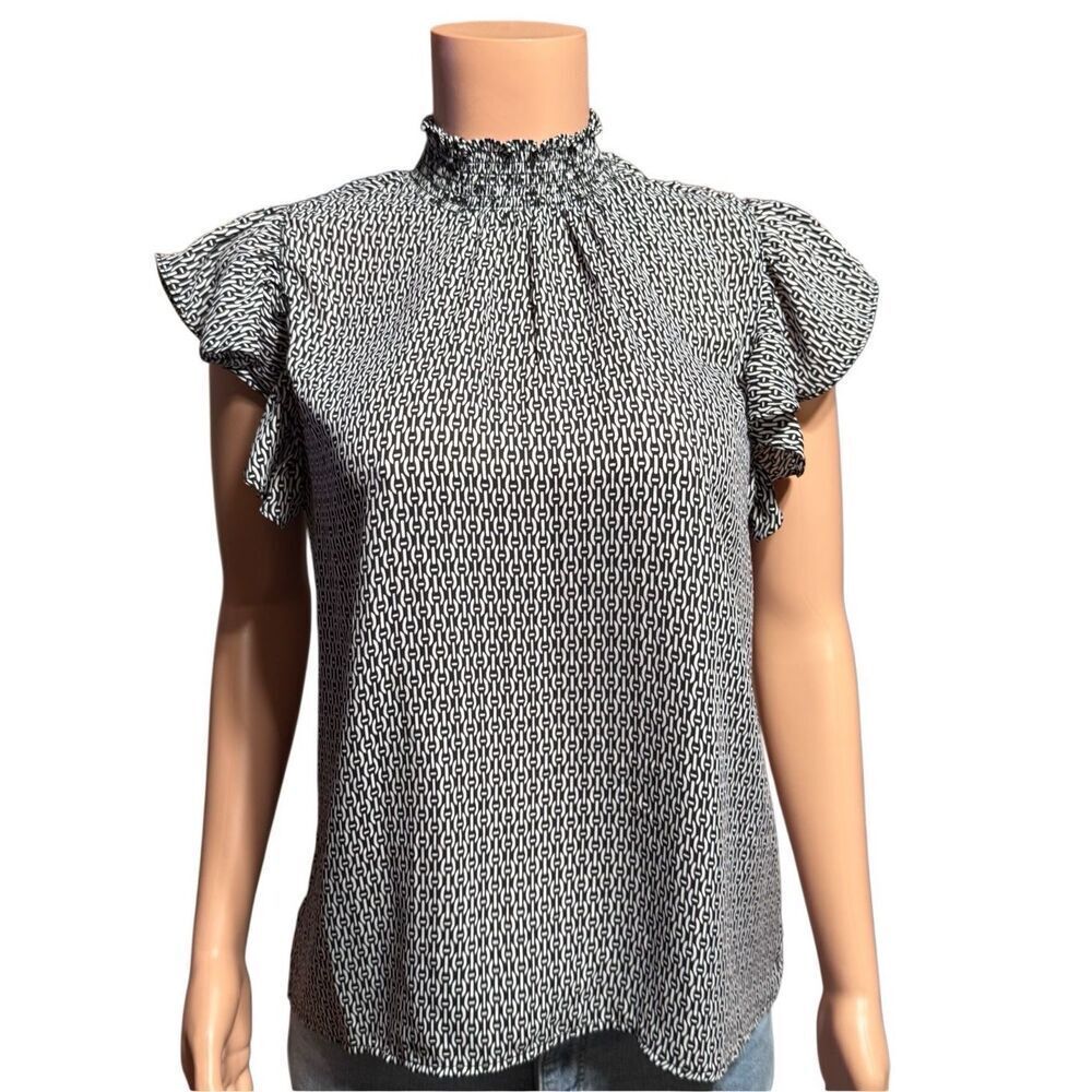 Alex & Lili high-neck ruffled blouse with a black and white geometric pattern. M